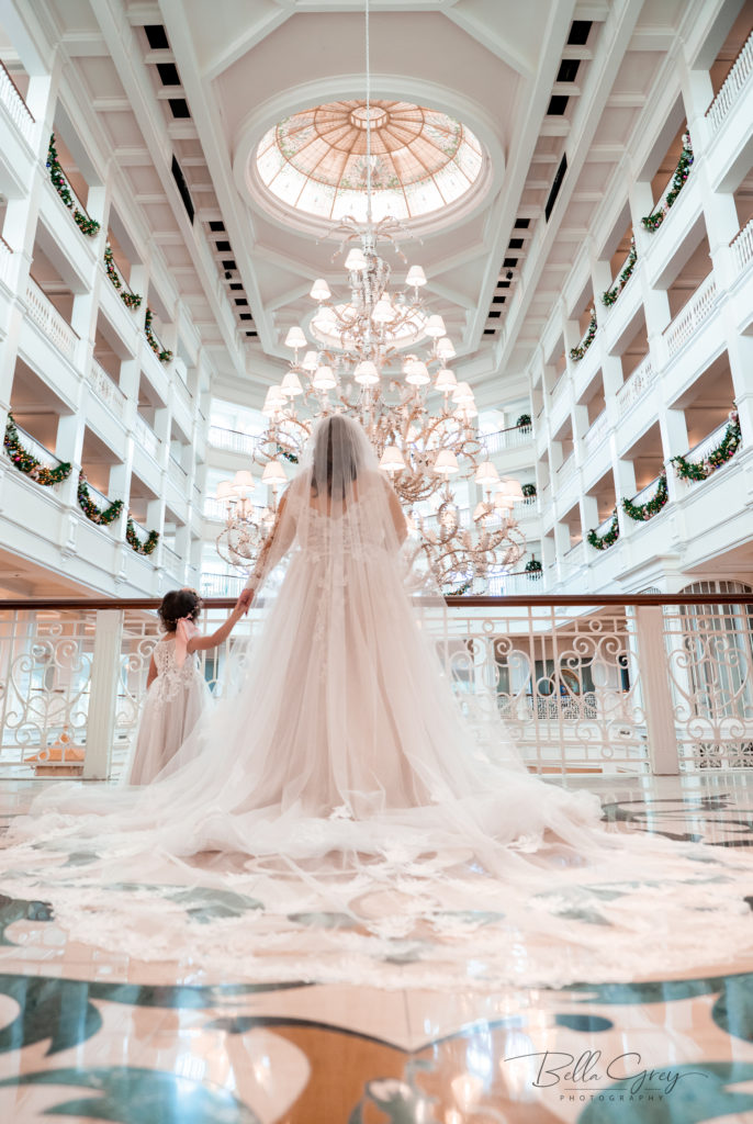 child and mother in wedding dresses at the Disney Grand floridian for a fairytale wedding 