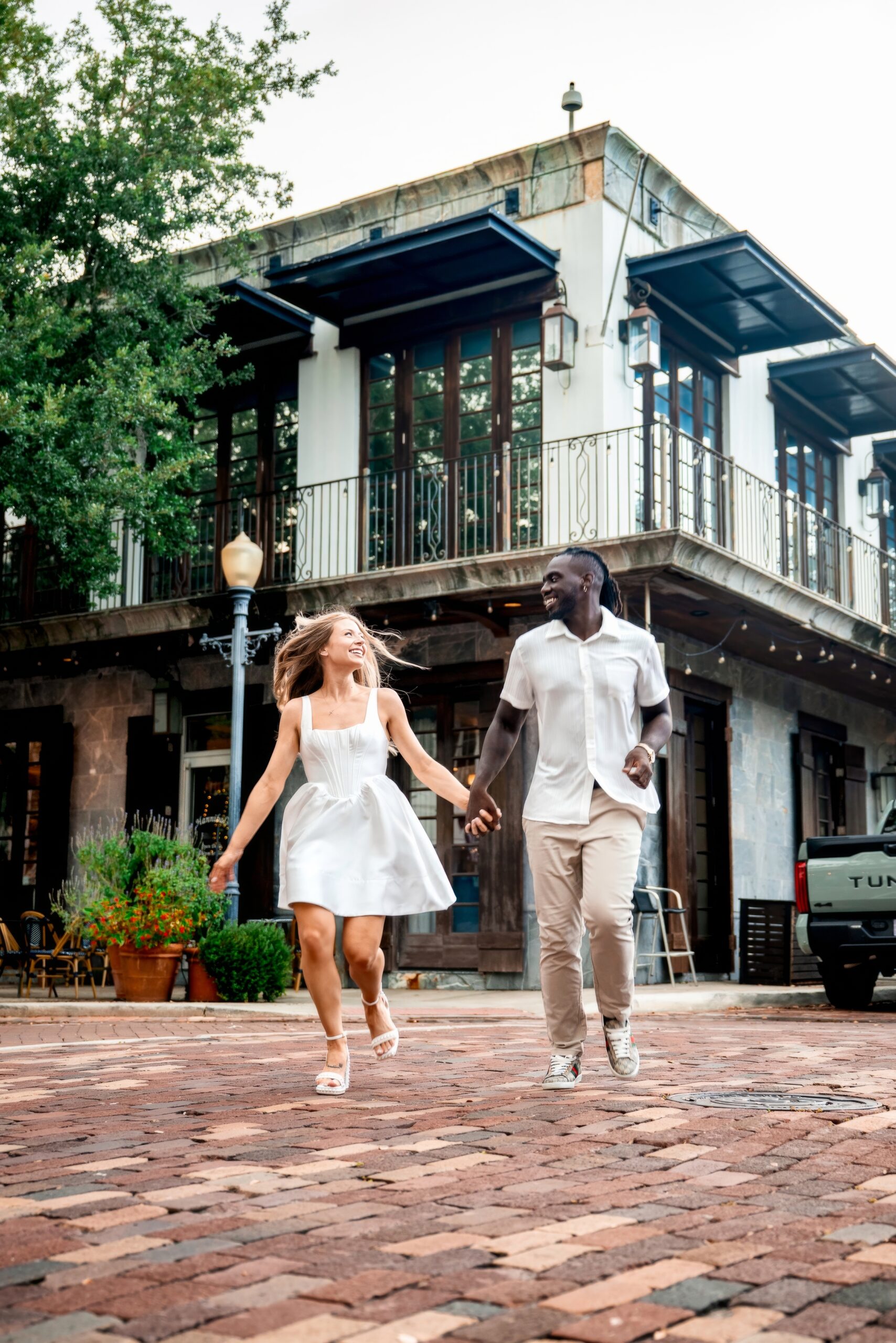 Couple running down the street in winter park FL