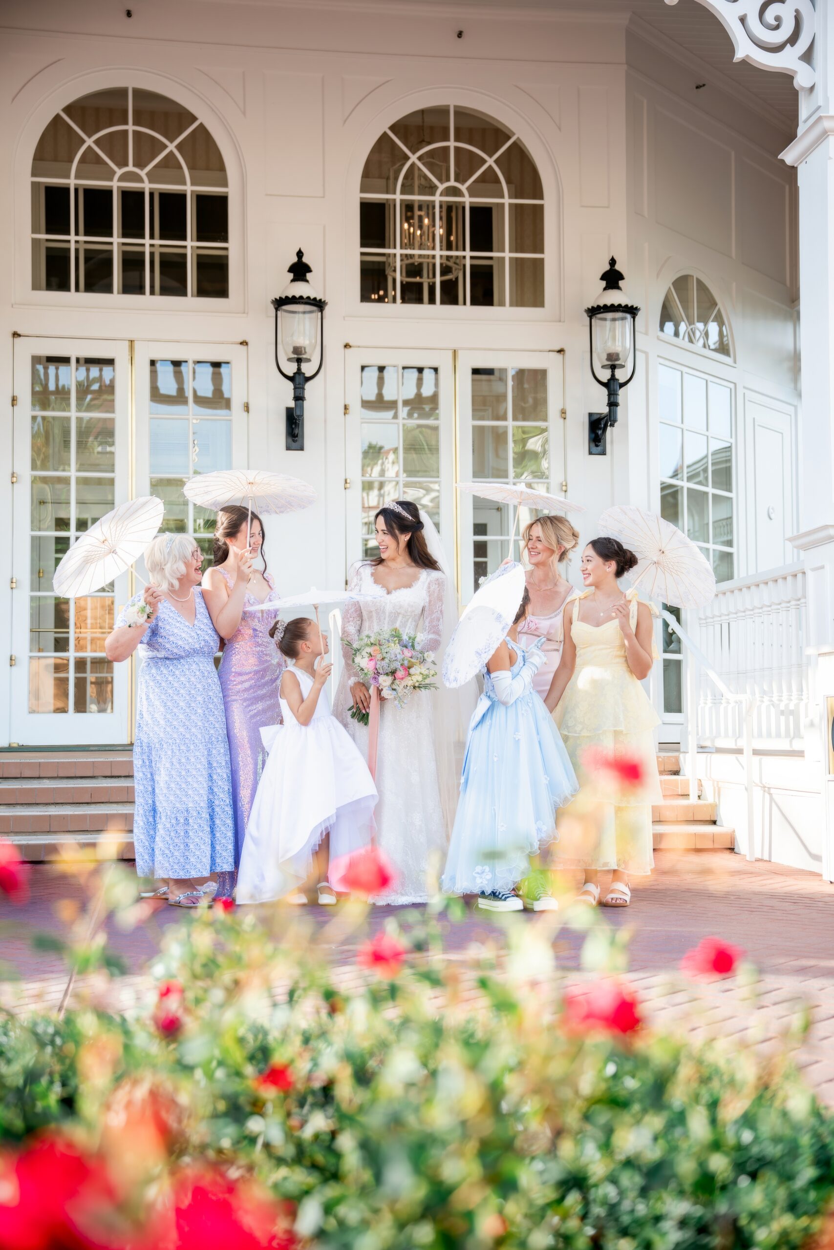 Bridal party parasol and colorful dresses