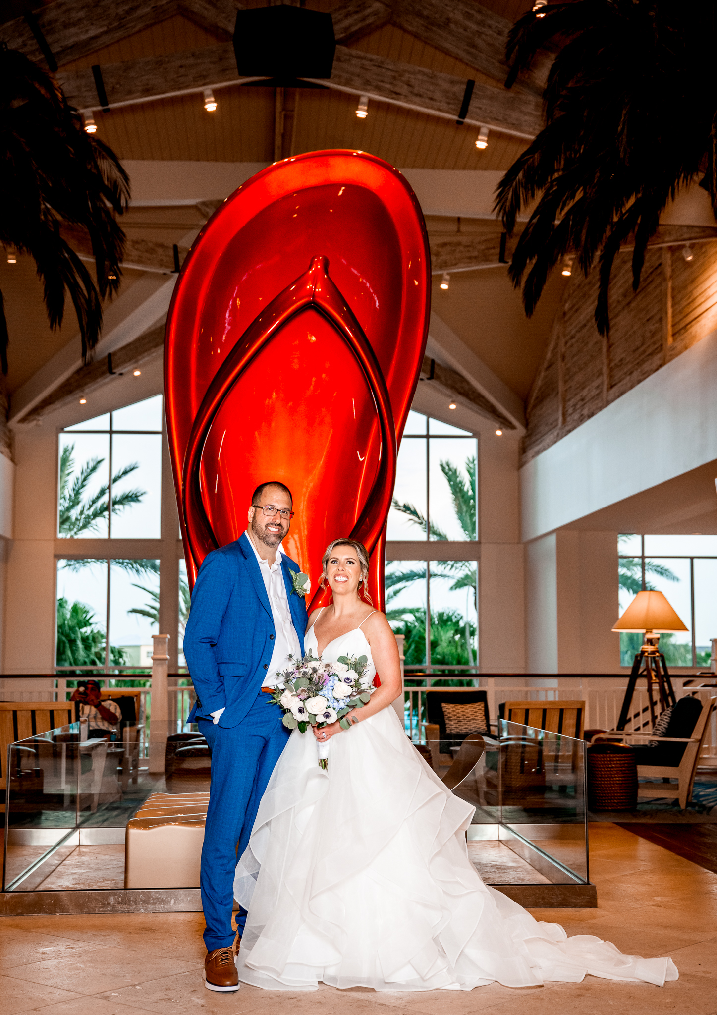 Editorial wedding photo with surfboard backdrop at Margaritaville

