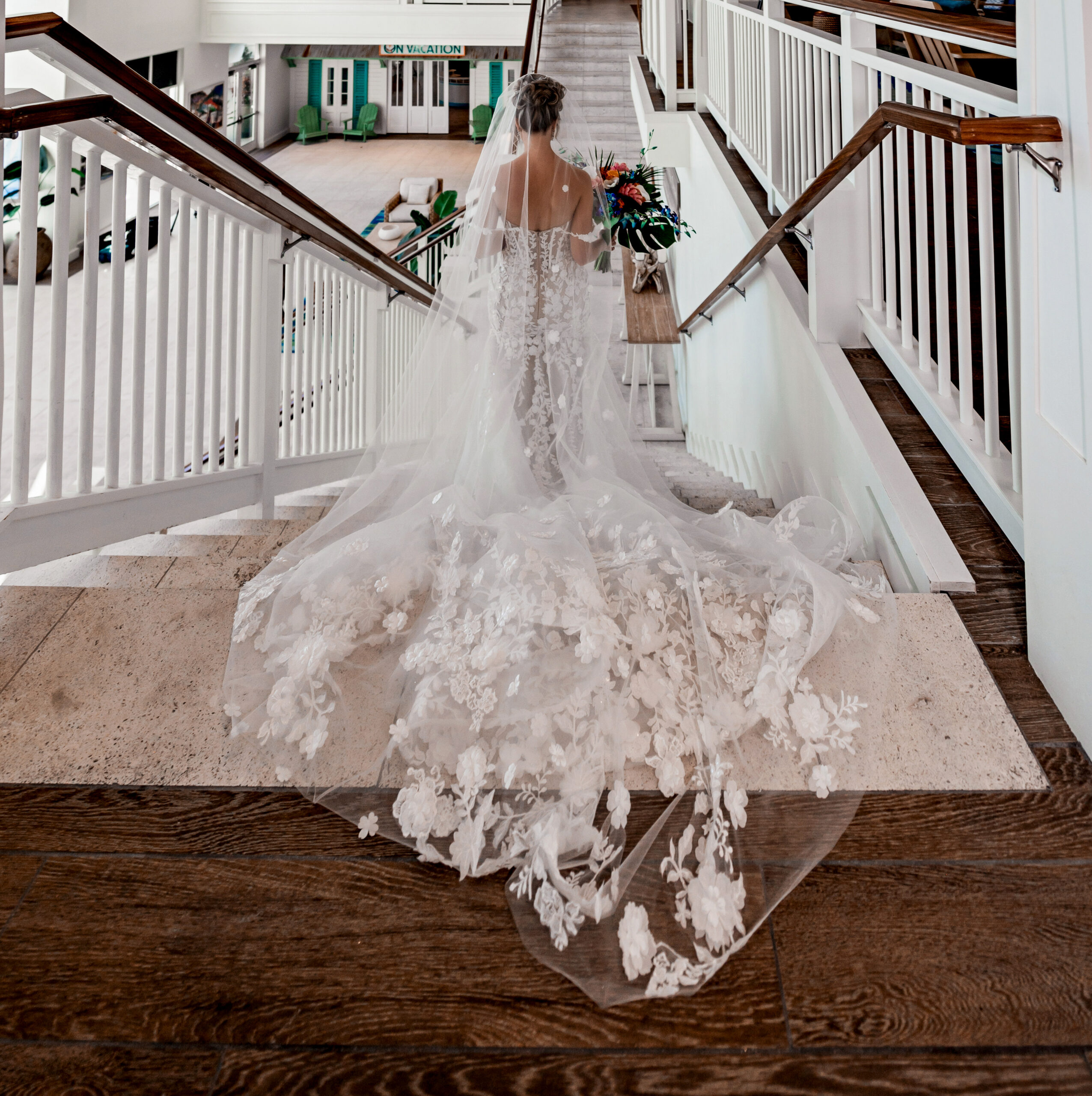 Bride in a custom-designed gown walking toward the ceremony location at Margaritaville Orlando

