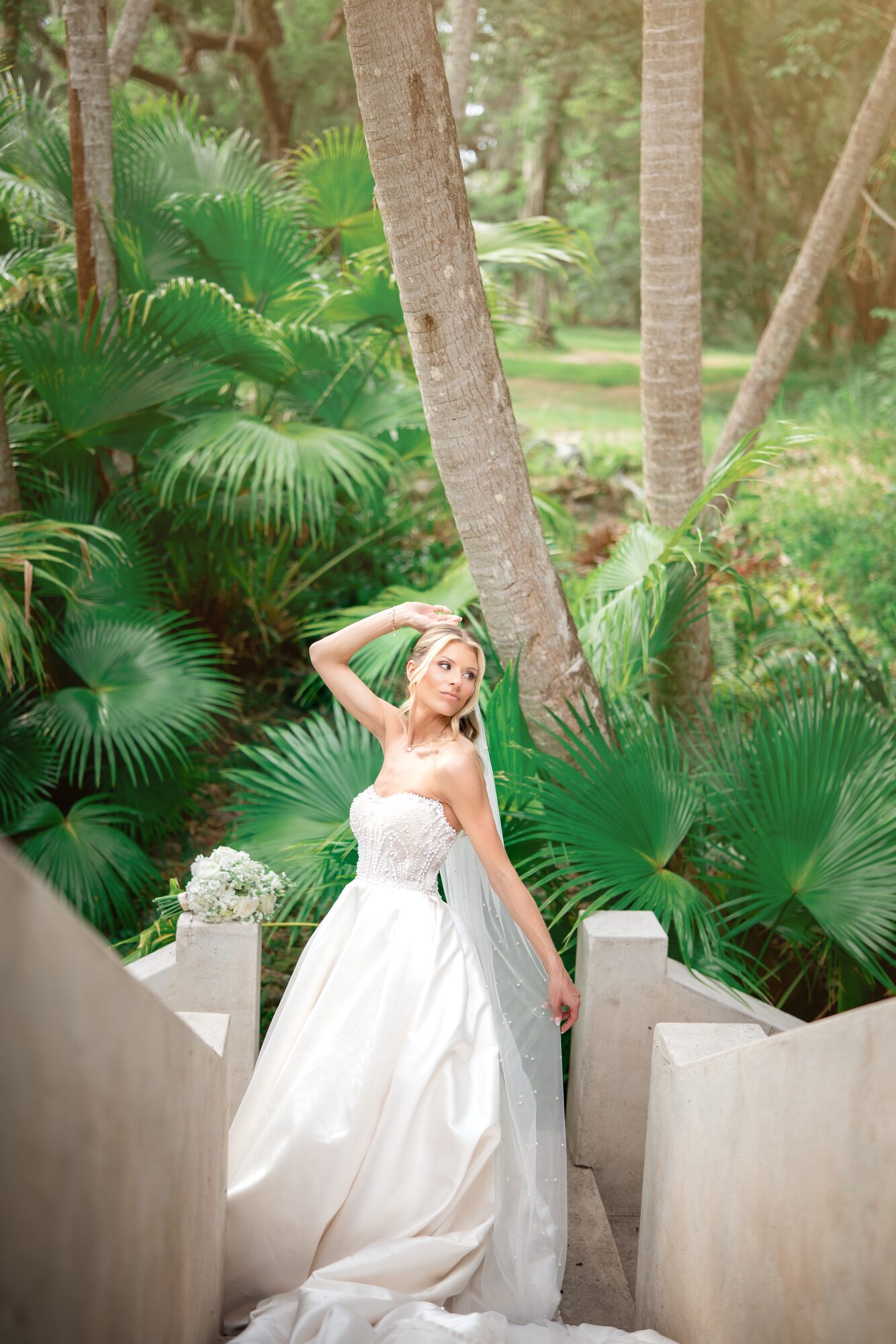 Bride portrait among tropical palms on the Sydonie Mansion grounds